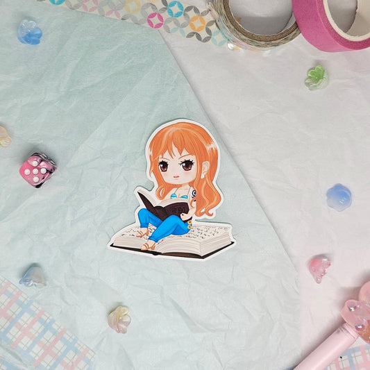 Sticker of Nami from One Piece reading
